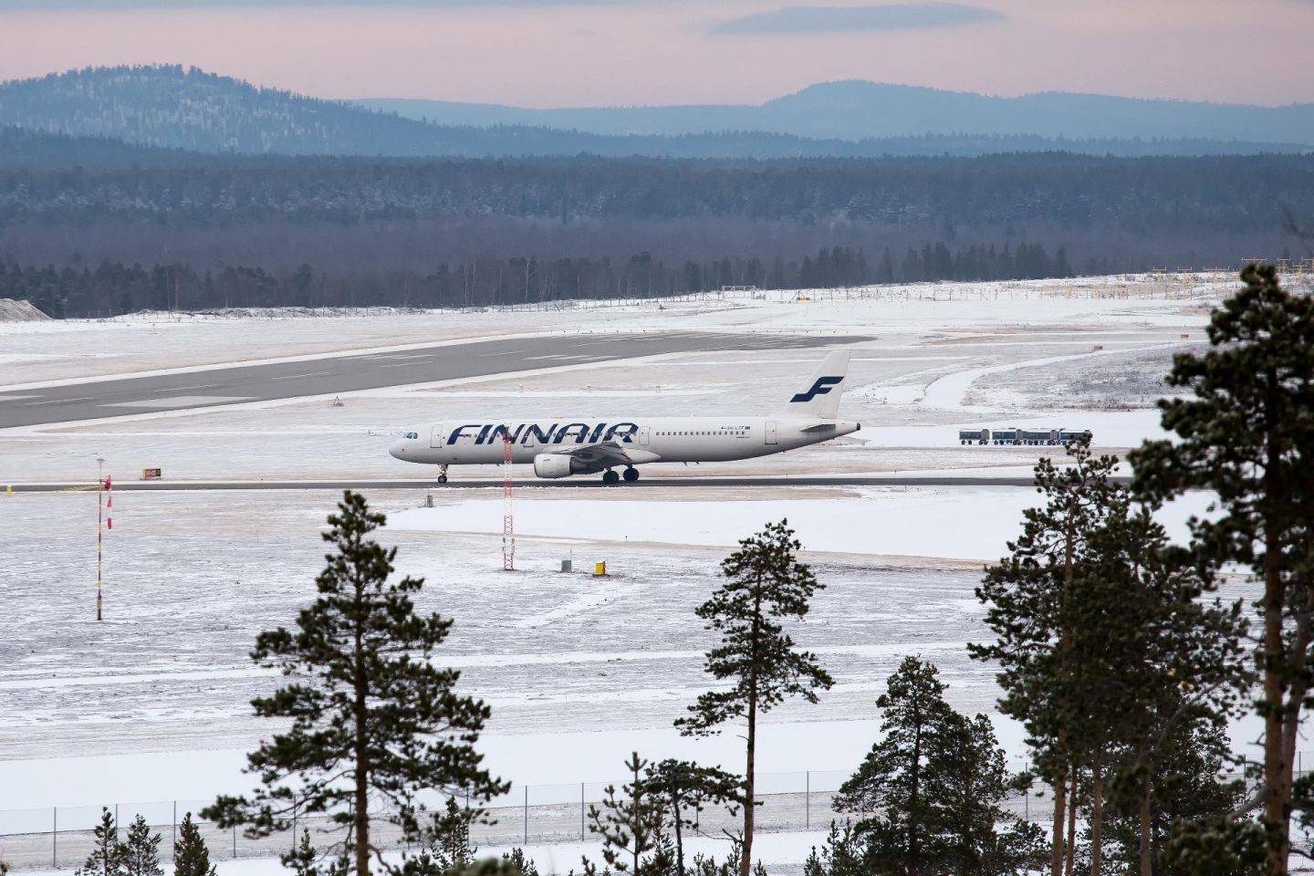 Ivalo airport and airplane, with fells in the distance