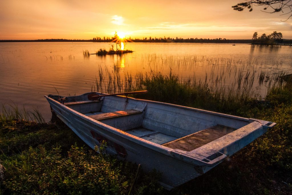 old boat & sunset in Lapland