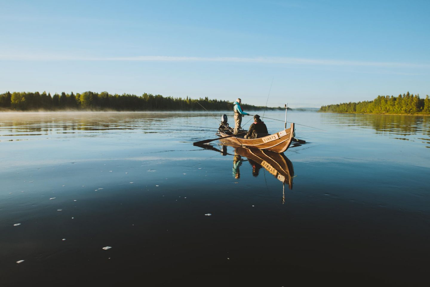 Fishing from rowboat in Pello, Finland in summer