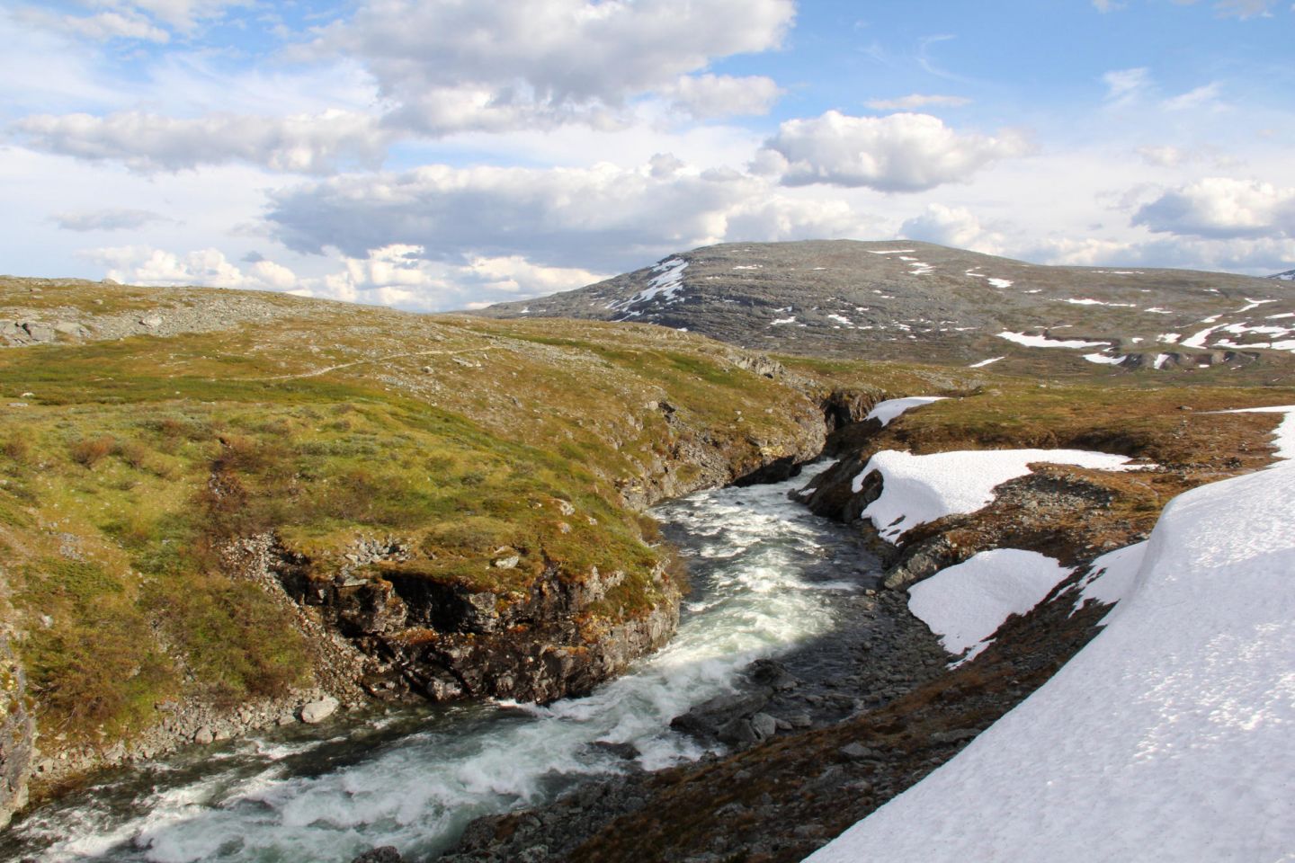 Arctic river with snow, during a fam trip in Finnish Lapland with location scout Lori Balton