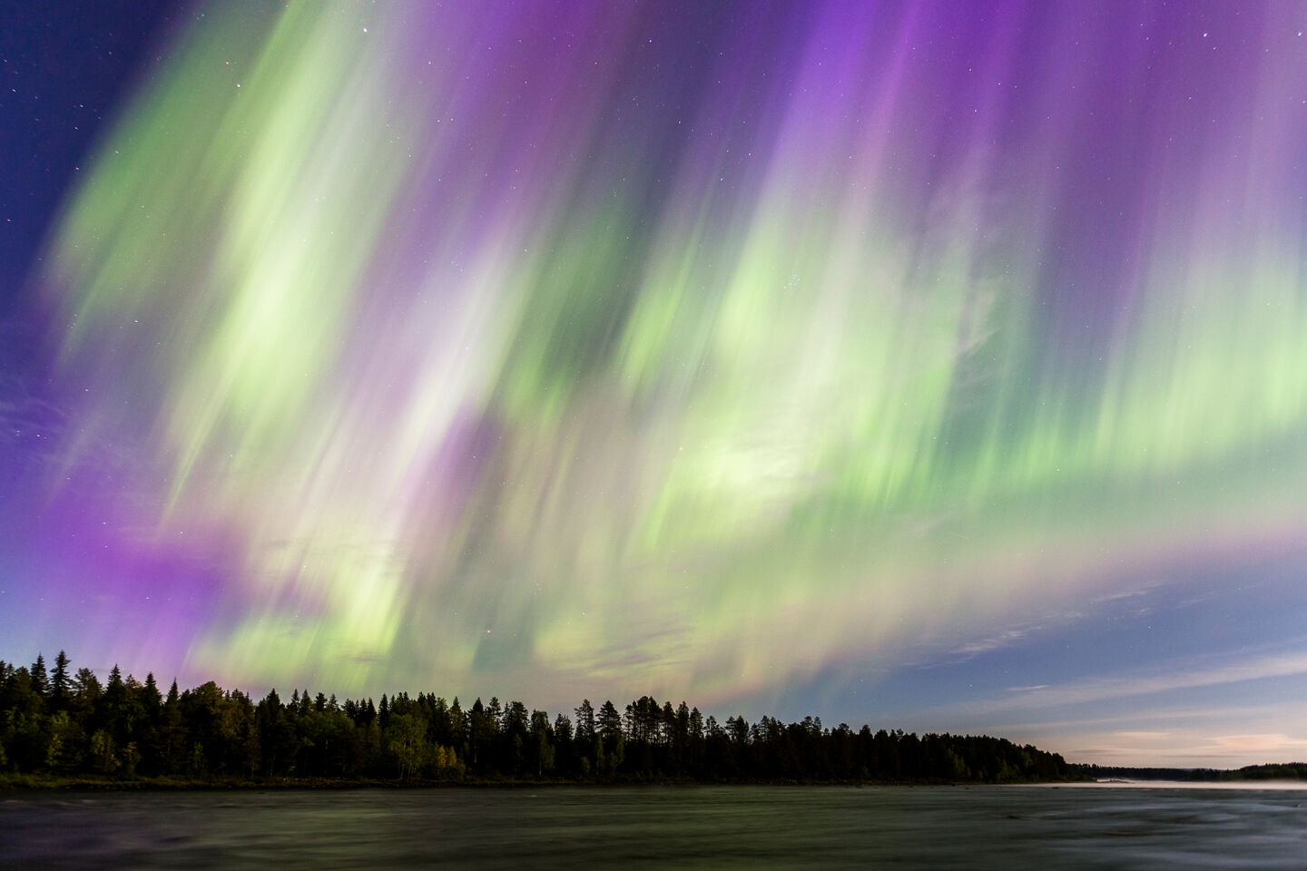 Auroras light up the sky over the Arctic Circle