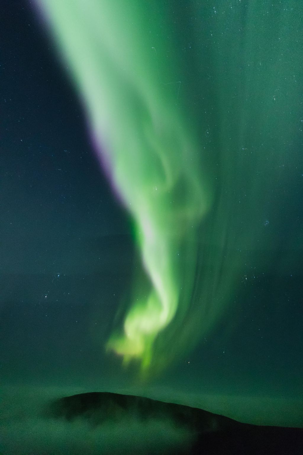 northern lights over fell in Lapland