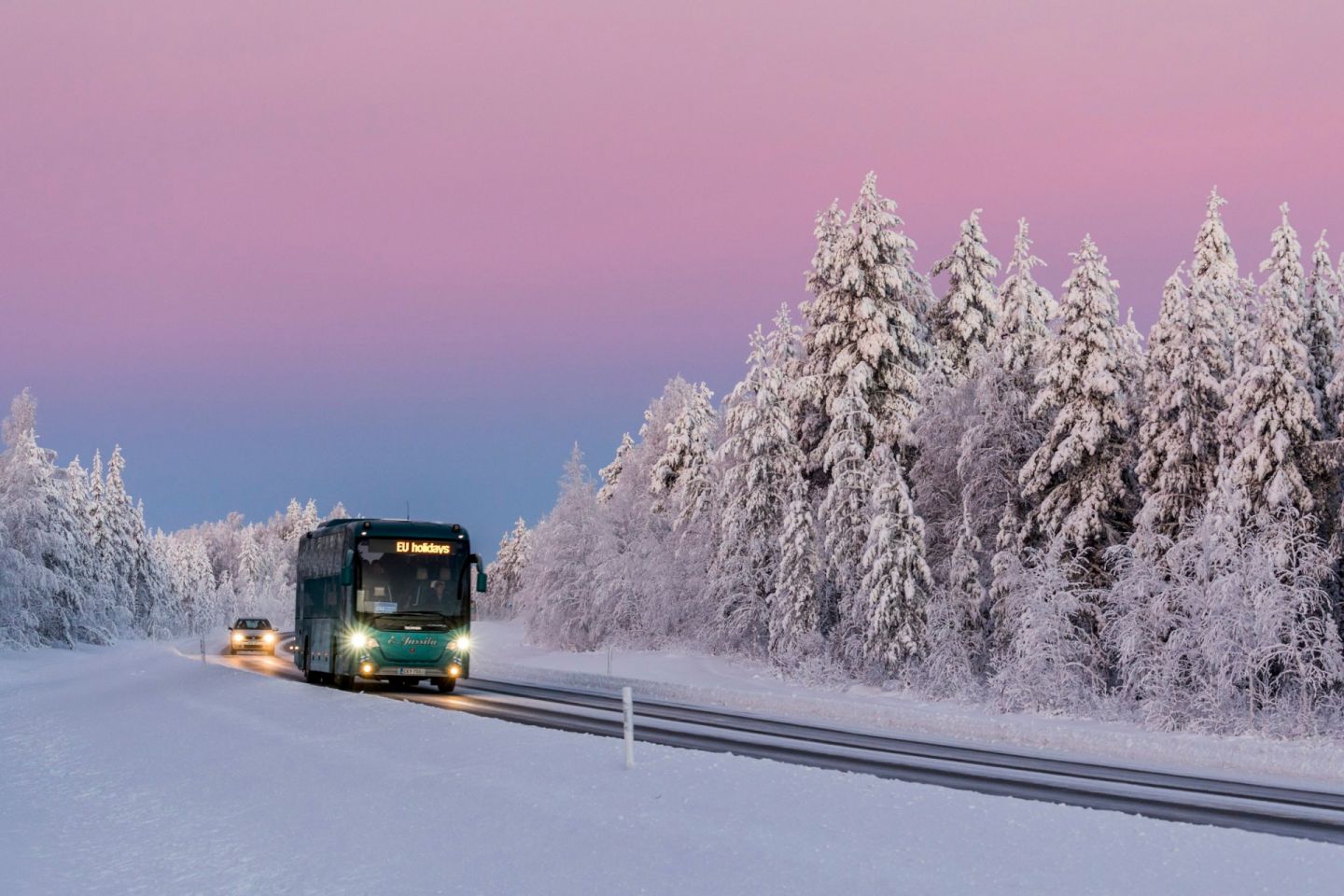 Charter bus travels through Ranua, Finland