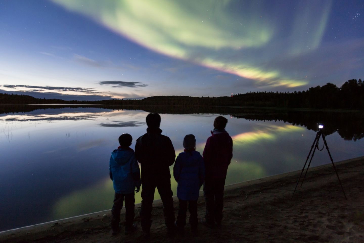 Enjoying the northern lights over Inari-Saariselkä, Finland in autumn