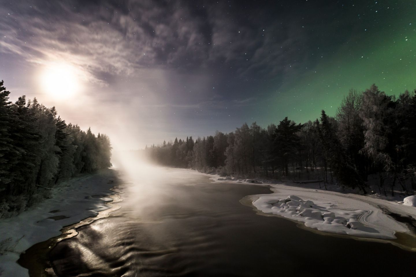 Northern Lights over a river in Finnish Lapland