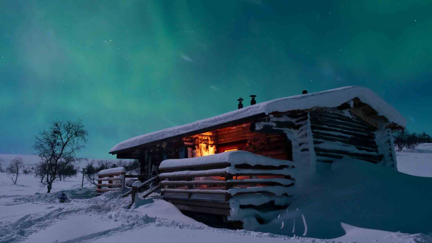 A snowy cottage in Lapland in winter