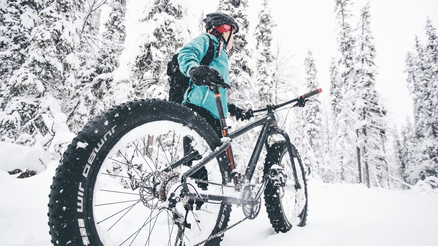 Fat-biking through heavy snow in Ylläs, Lapland in winter