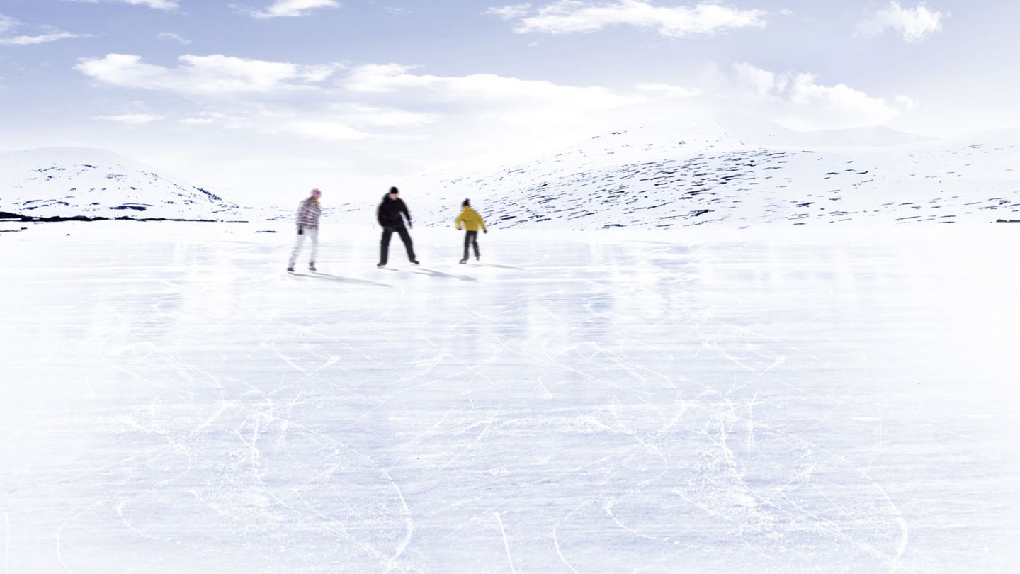 Ice skating on a frozen Lapland lake in spring in Finland