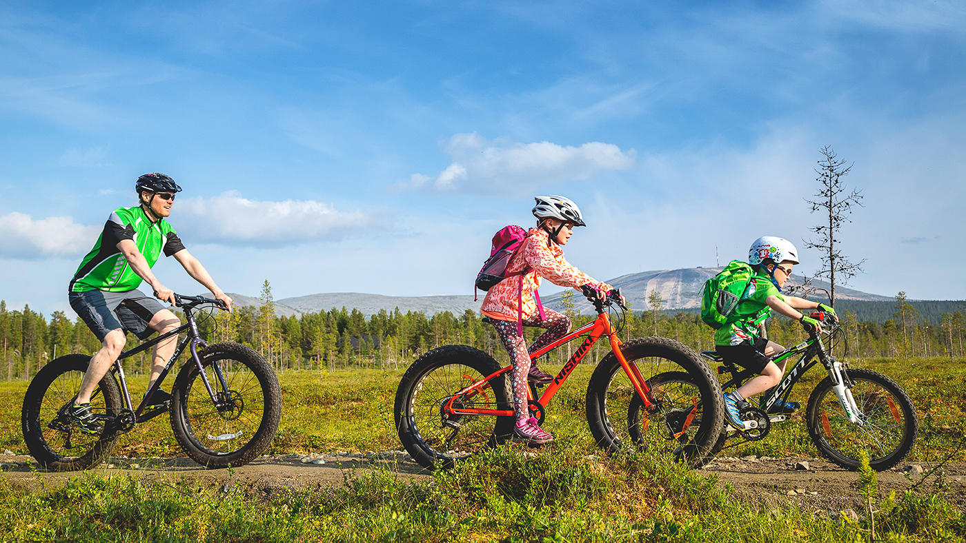 Cycling under the summer sun in Lapland