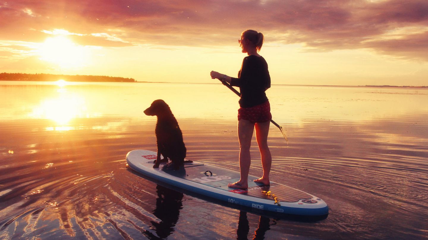 SUP boarding under the Lapland summer sun