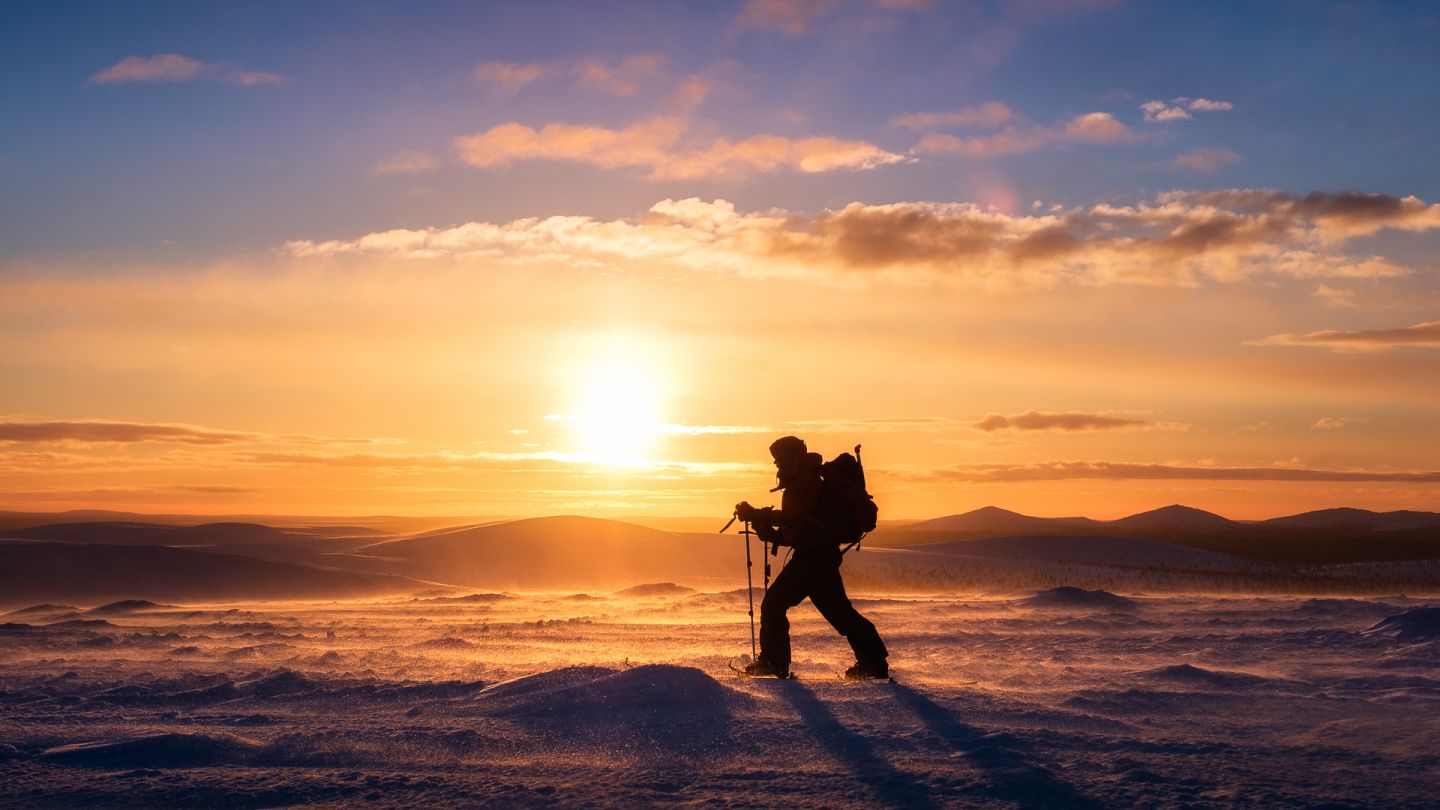 Juha Kauppinen, arctic wilderness photographer, against a Lapland sunset