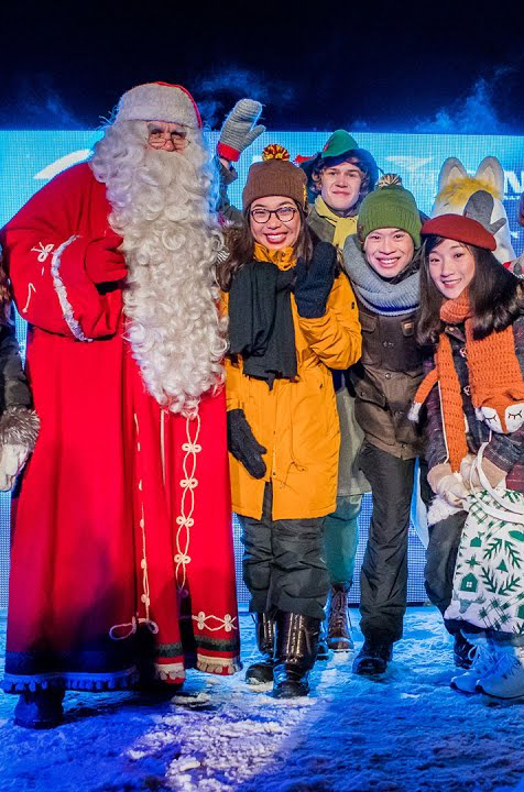 Santa Claus with tourists in Lapland