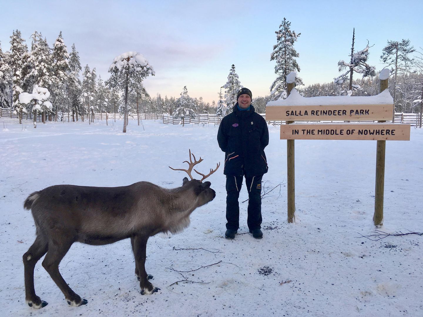 Jarko next to a signpost in the middle of nowhere (Salla, Lapland)