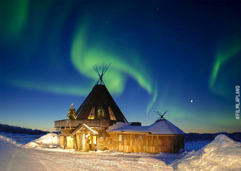 Northern Lights over a frosty hut in Levi, Finland