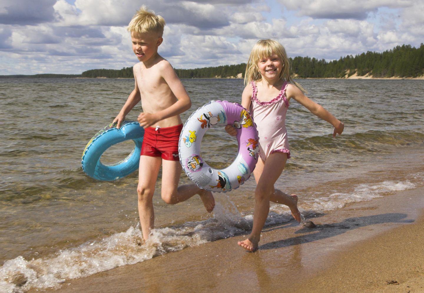 Children play on the beach in Posio, Finland