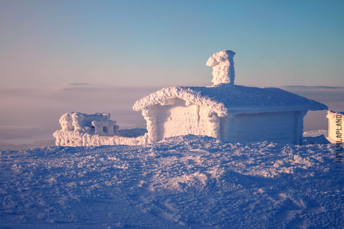 snow-covered cottage in Levi, Finland