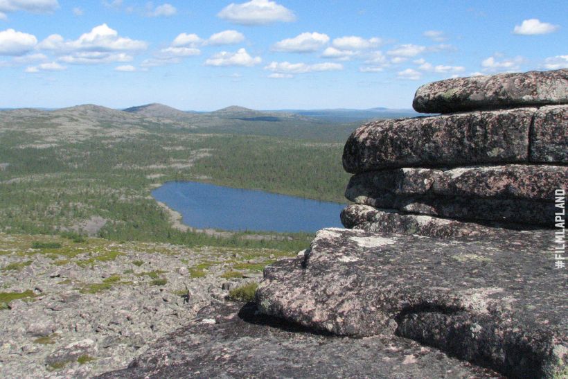 Stone formation and distant lake in Sodankylä, Finland
