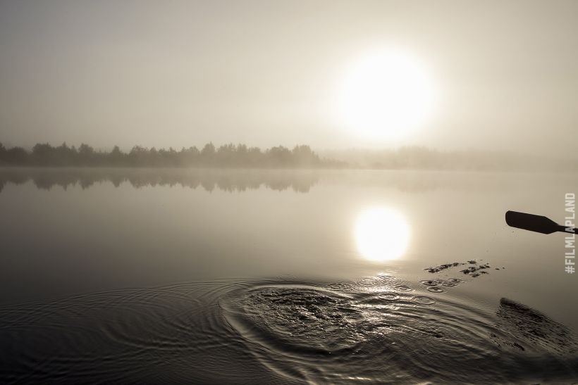 Midnight Sun over a misty lake in Sodankylä, Finland