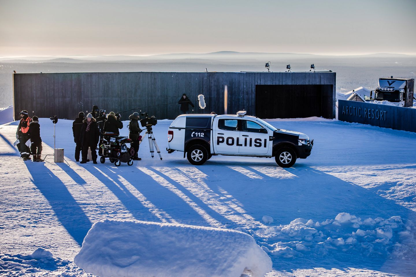 film crew following a police vehicle on the set of Arctic Circle, filmed in Lapland, Finland