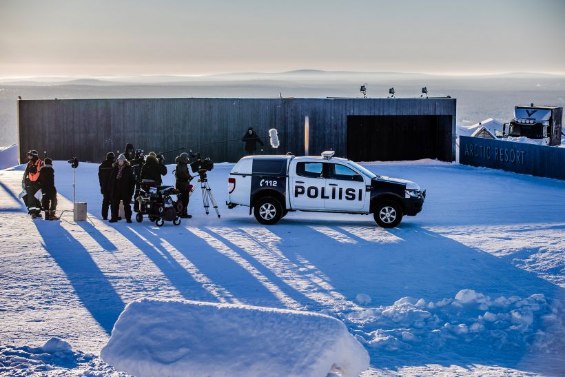 film crew following a police vehicle on the set of Arctic Circle, filmed in Lapland, Finland