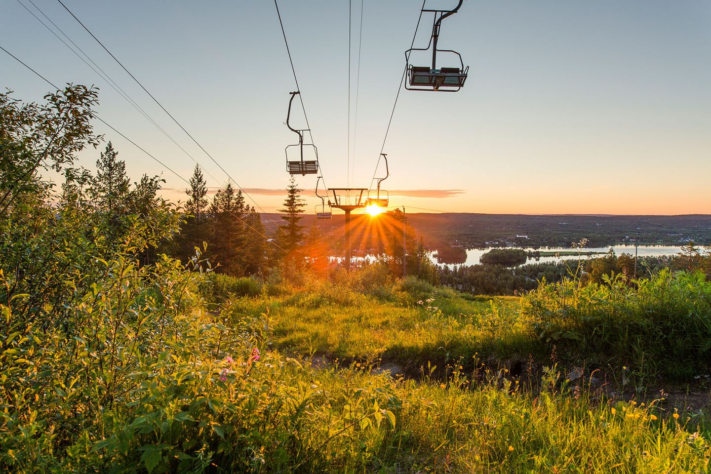 Midnight sun behing the ski lifts in Ounasvaara, Finland