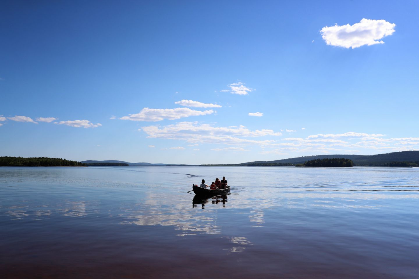 Boating in Lake Kemijärvi, Finland in summer