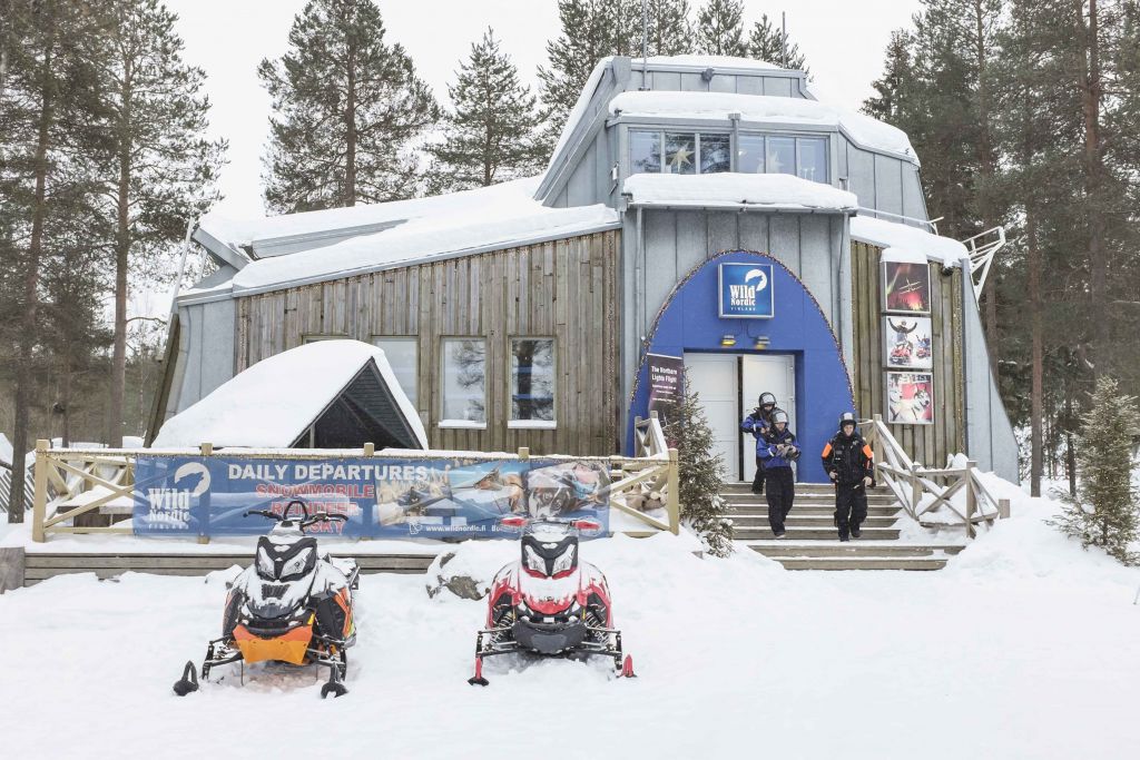 Male snowmobile guide in lapland at wild nordic office