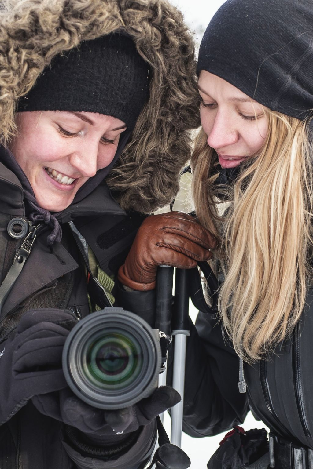 female guides taking photos and smiling