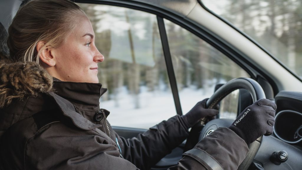 female guide driving car in lapland