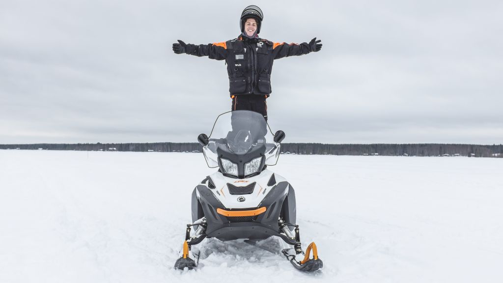 Male snowmobile guide in lapland