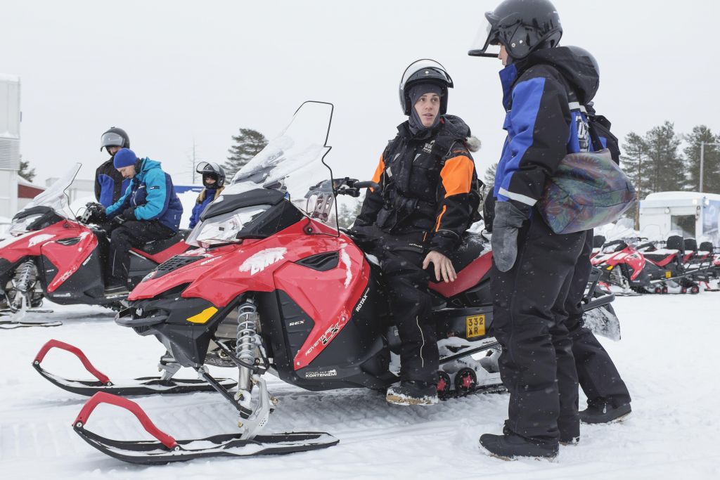 Male snowmobile guide in lapland