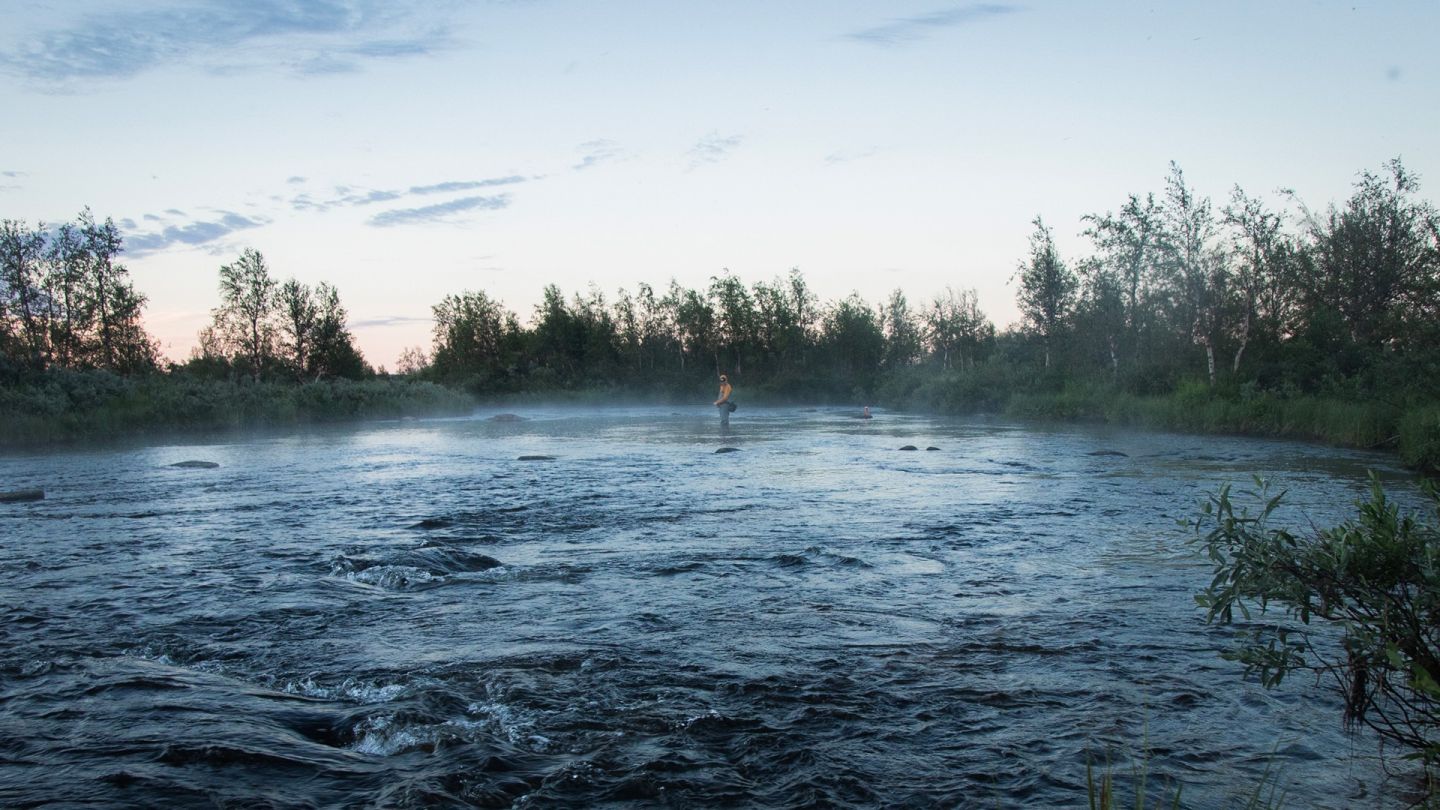 Misty river, fishing Lapland