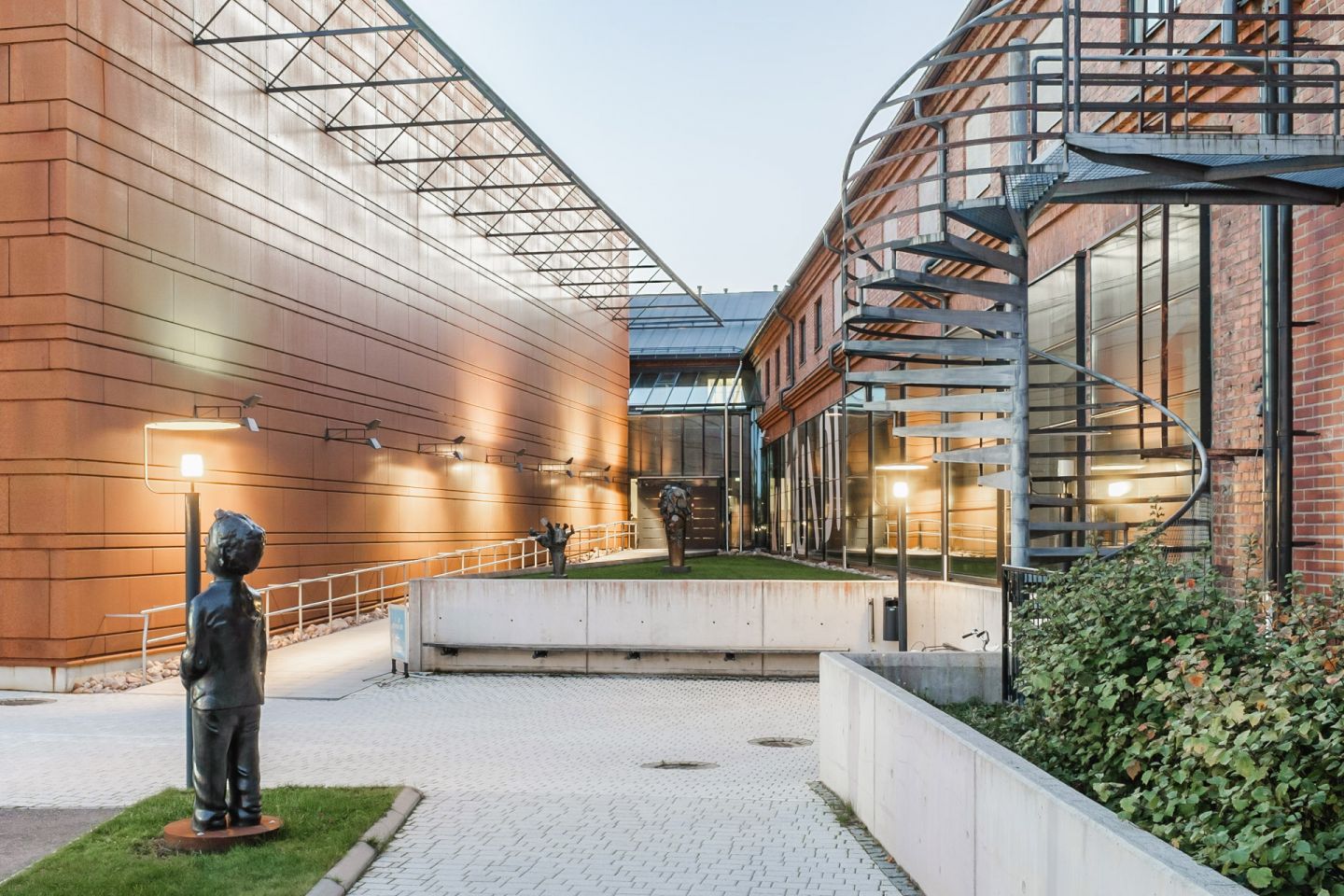 courtyard entrance to Korundi Art Museum, gallery space, evening or night.