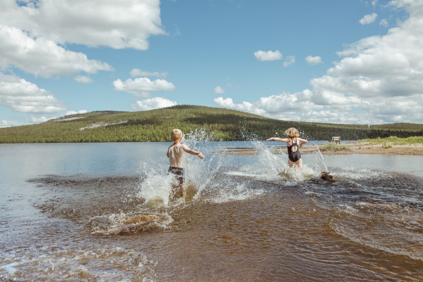 Children enjoying the water in Pyhä & Luosto in Lapland