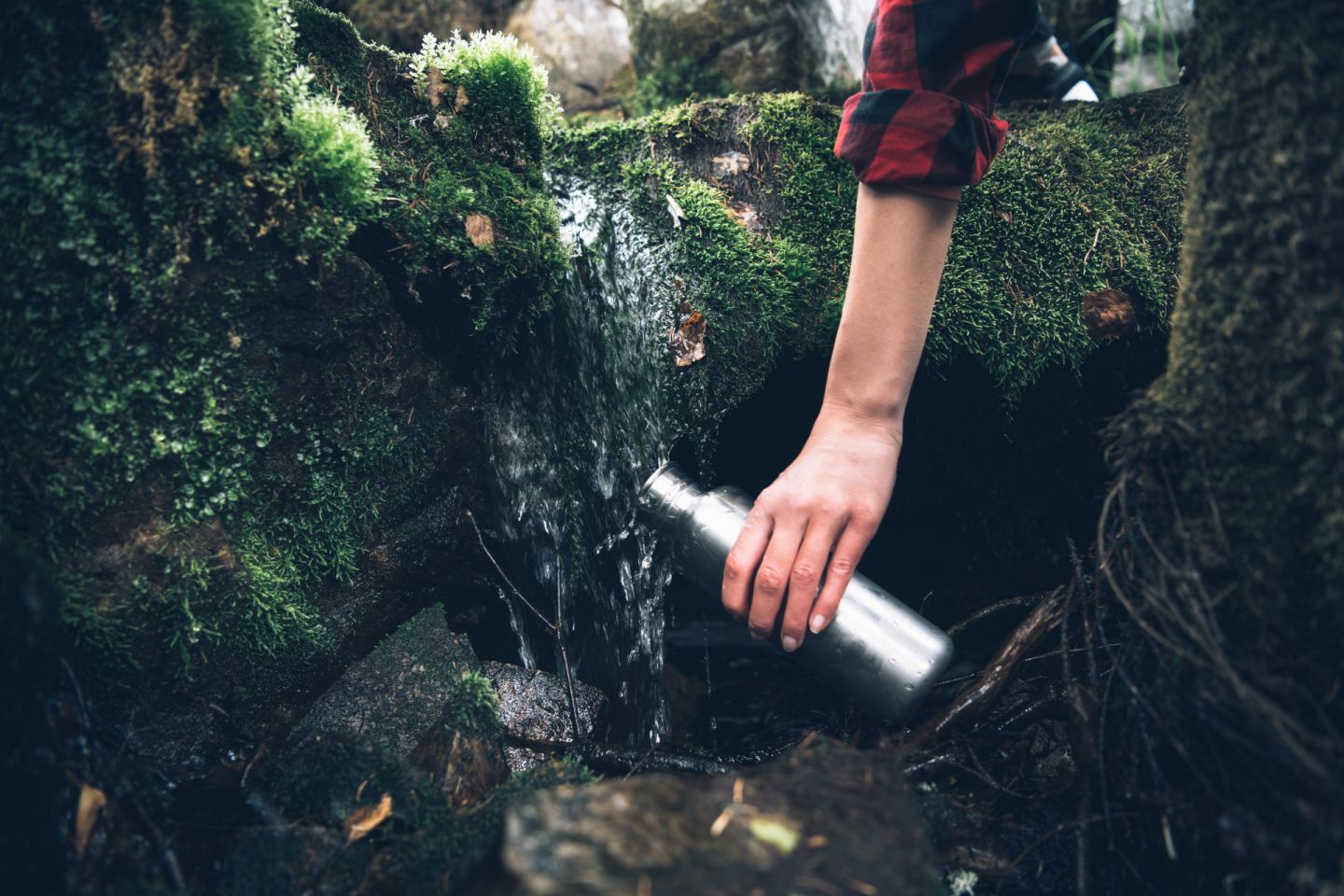 Taking a bottle of fresh spring water in Finnish Lapland