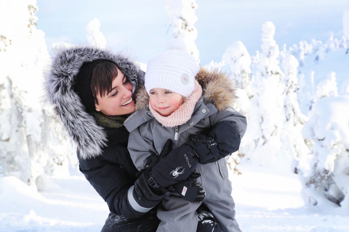 A family enjoying the winter in Finnish Lapland