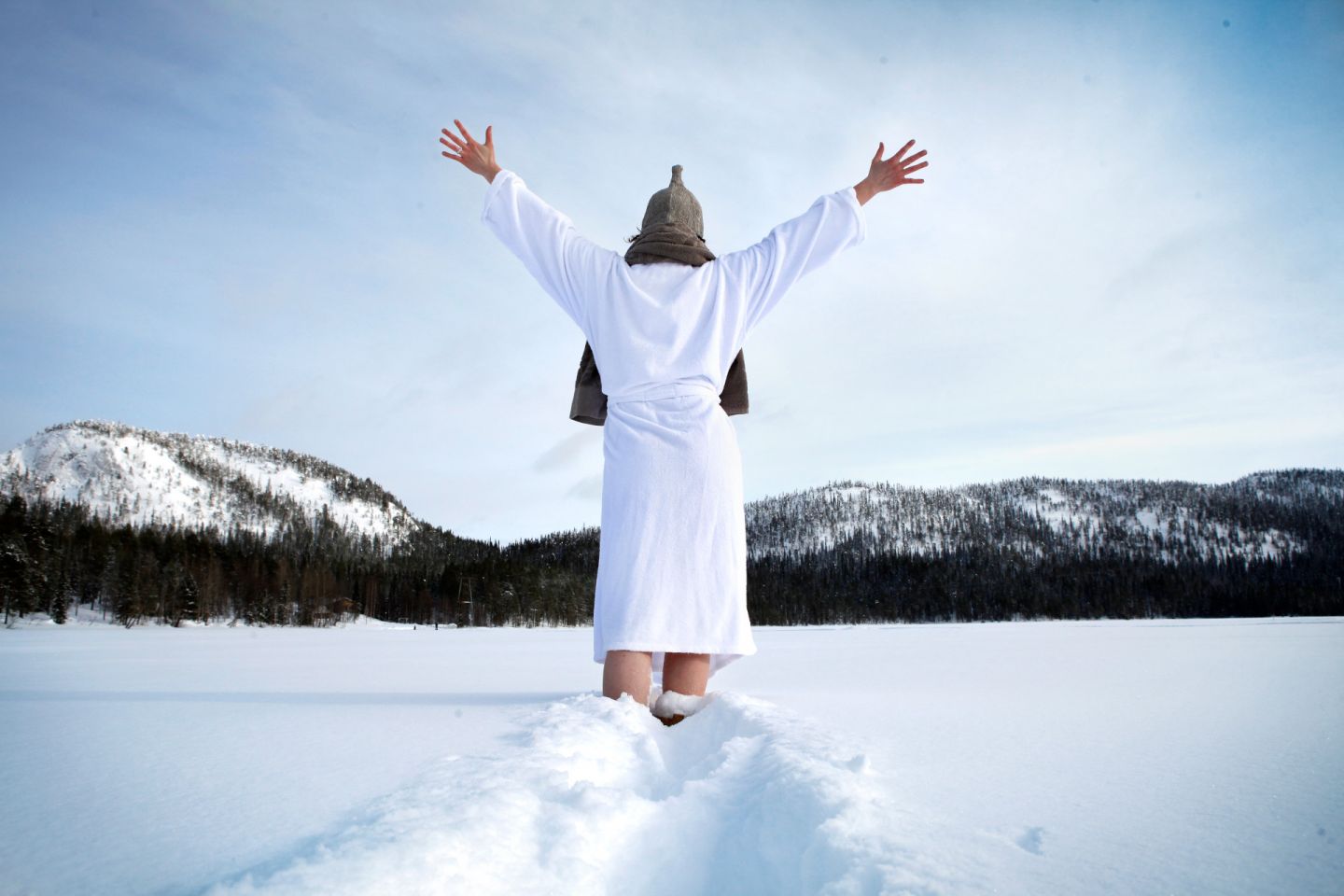 Enjoying the snow after sauna in Ruka, Finland