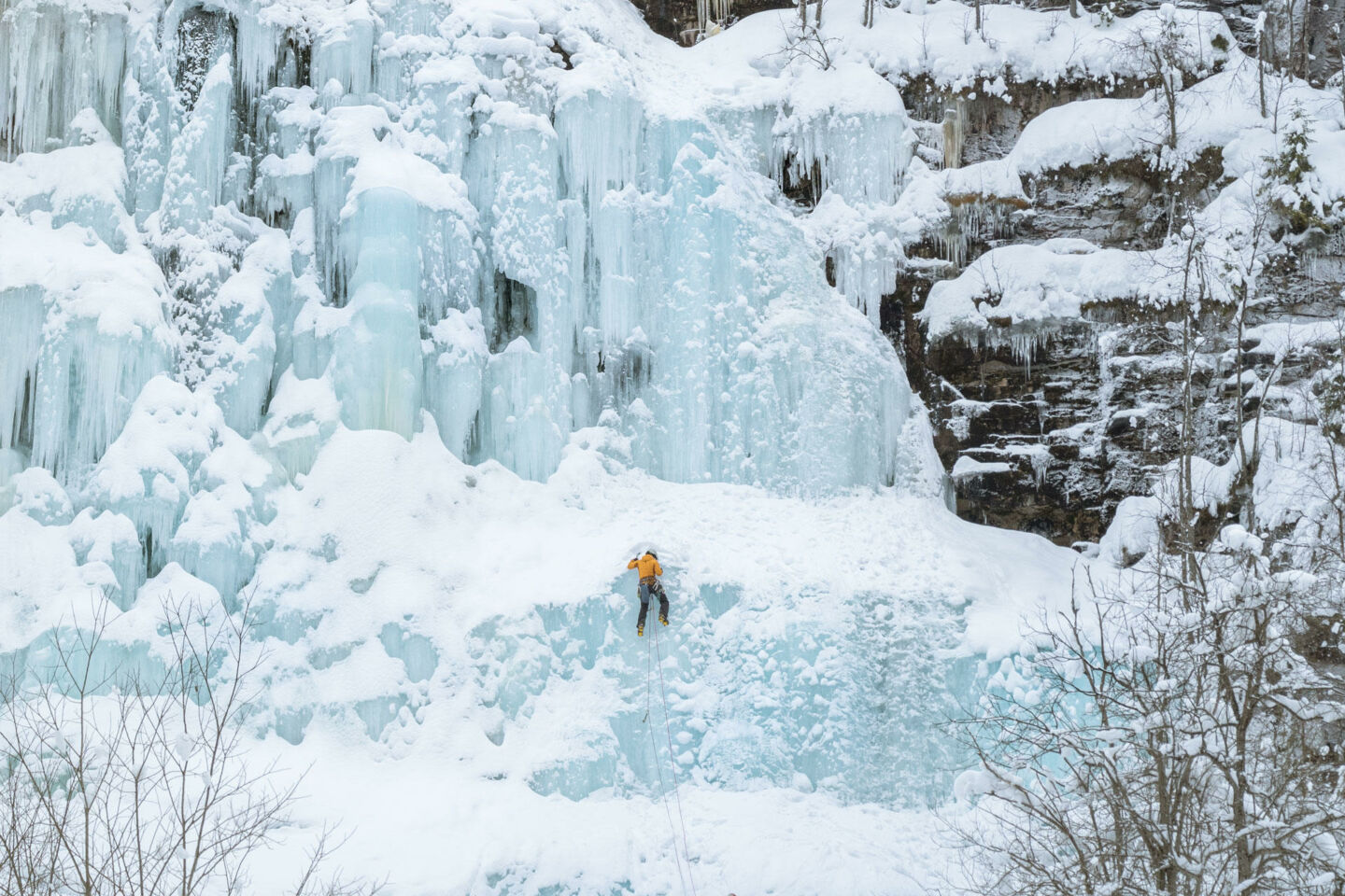 Climbing the frozen waterfall at the Korouoma Canyon in Posio, a Finnish Lapland filming location