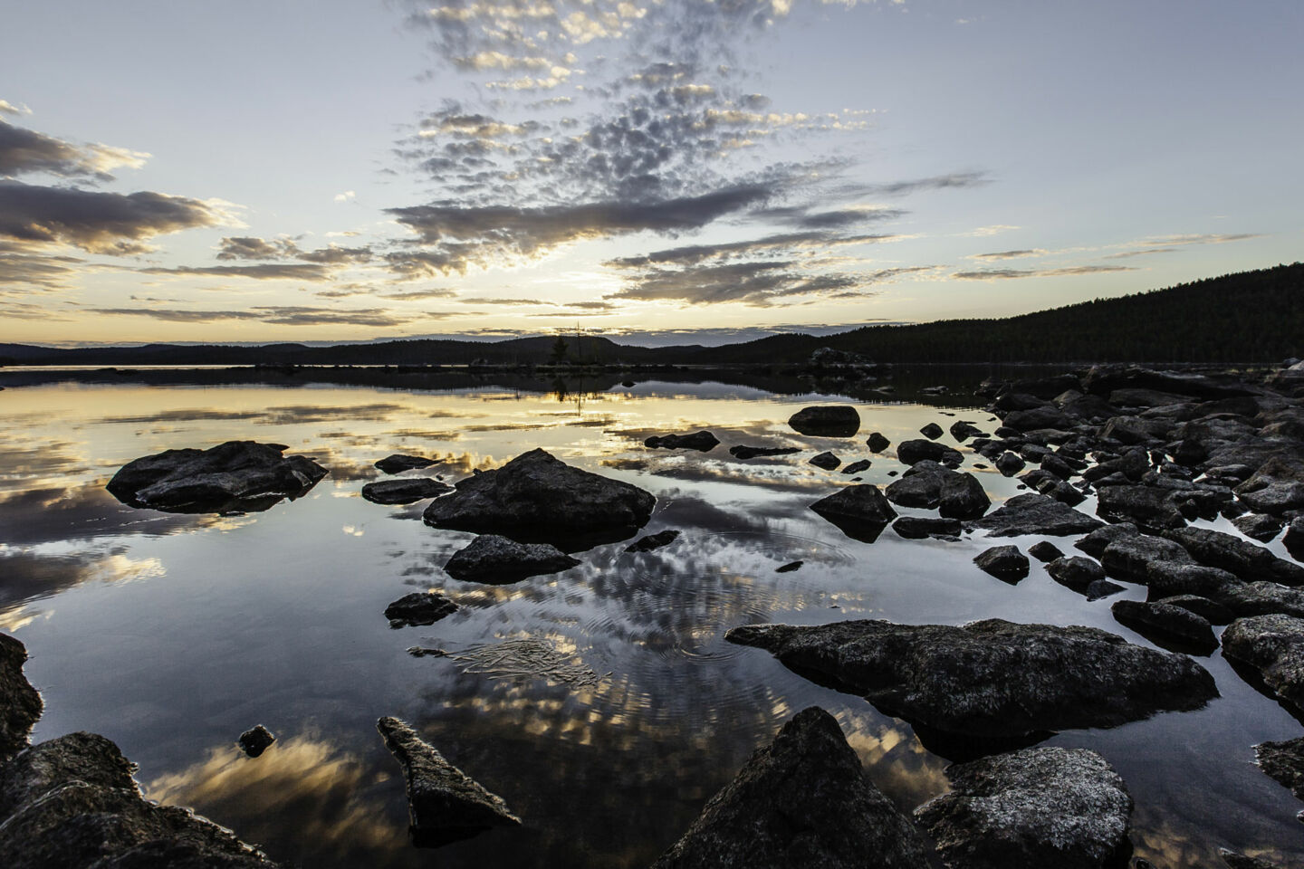 Sunset over the stony shores of Lake Inari in summer, a filming location in Finnish Lapland