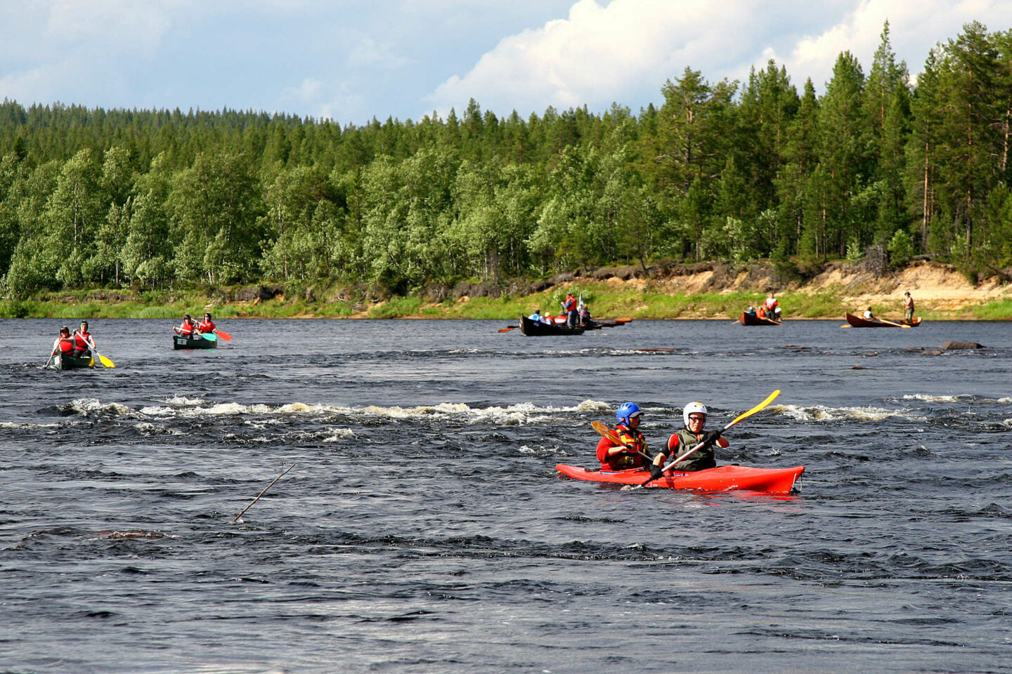 Canoes, kayaks and rafts on the rivers and rapids of Muonio, a Finnish Lapland filming location