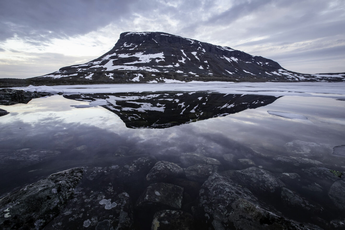 A winter reflection of Mt. Saana, an Arctic fell in Kilpisjärvi, a Finnish Lapland filming location