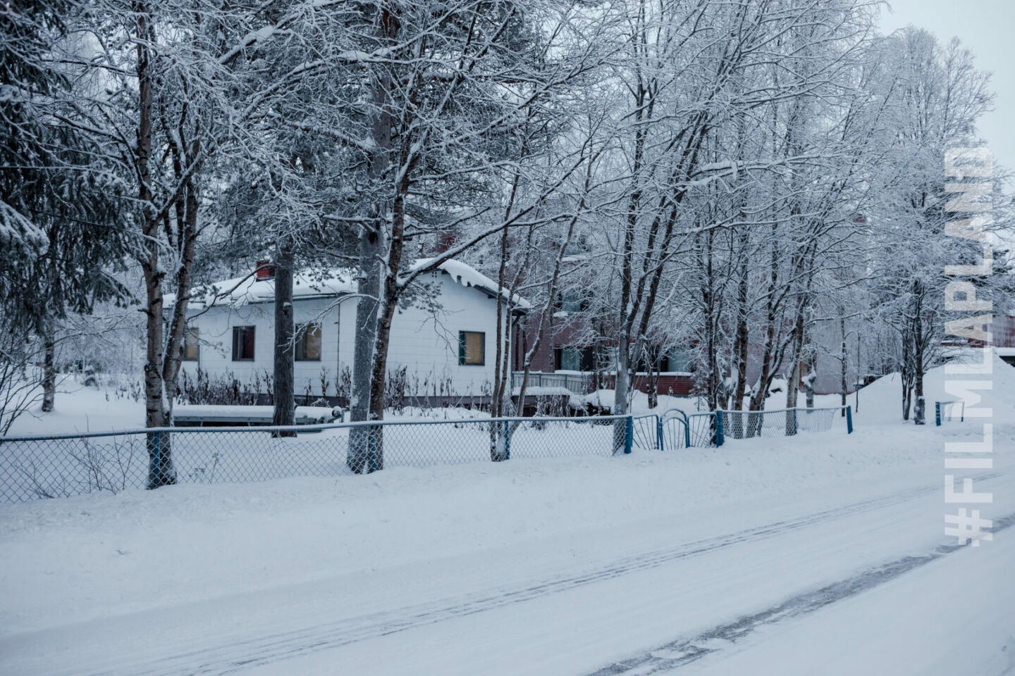 A small home and fence in the retro town Sodankylä, a top filming location in Finland