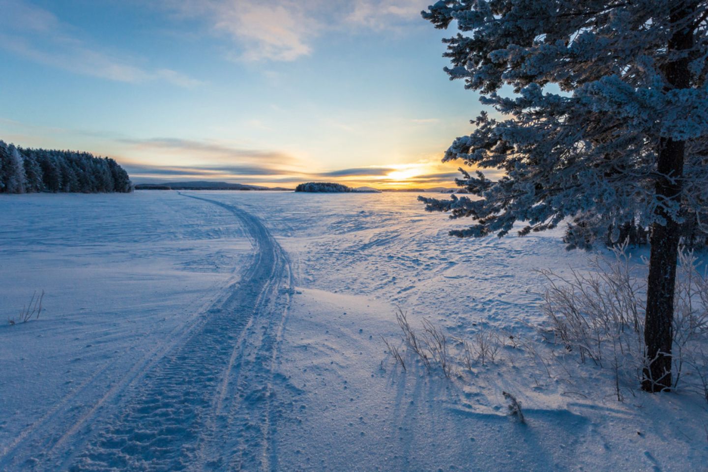 A snowmobile path across Lake Kemijärvi on the Arctic Circle