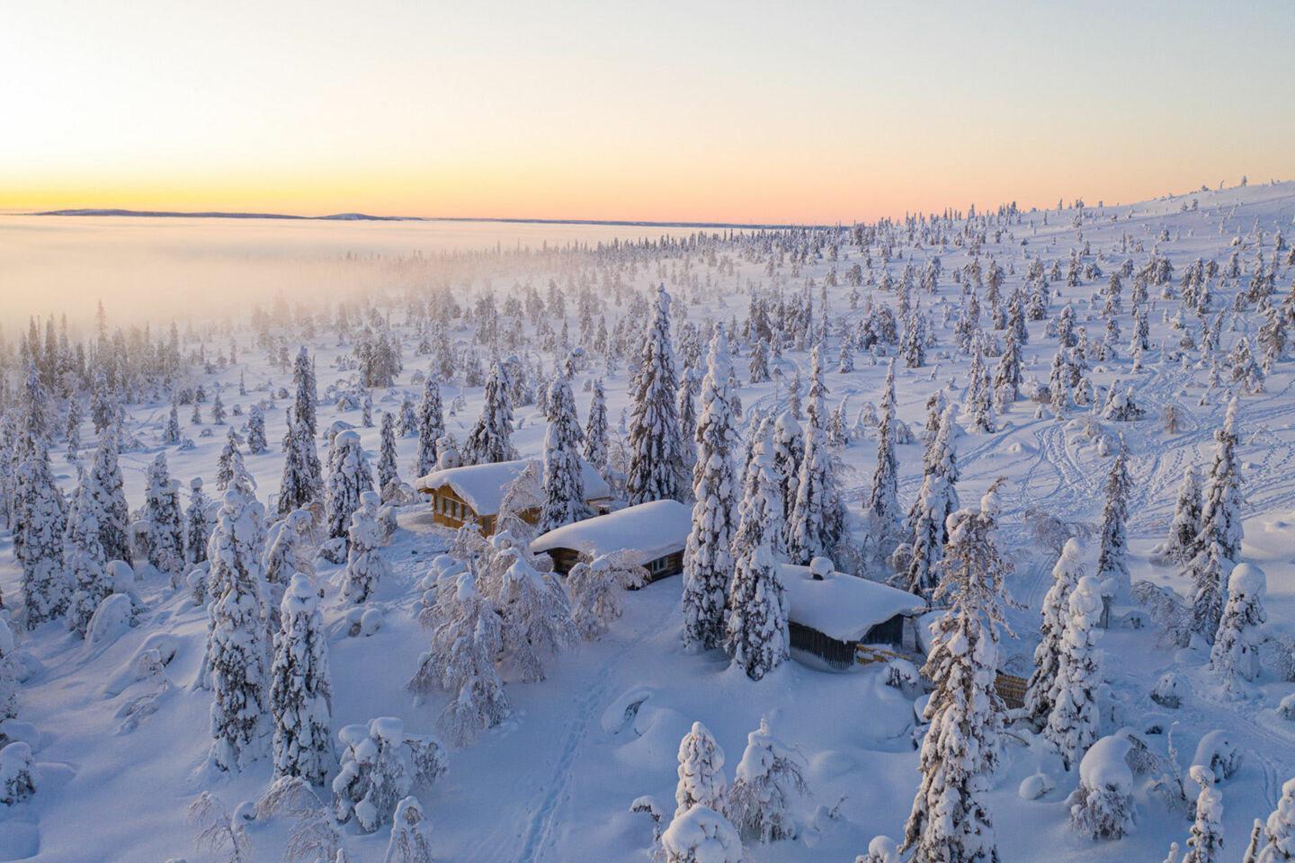 A cabin among the snow-crowned trees in Riisitunturi National Park in Posio, a Finnish Lapland filming location