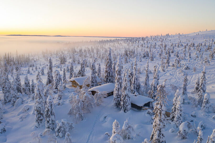 A cabin among the snow-crowned trees in Riisitunturi National Park in Posio, a Finnish Lapland filming location