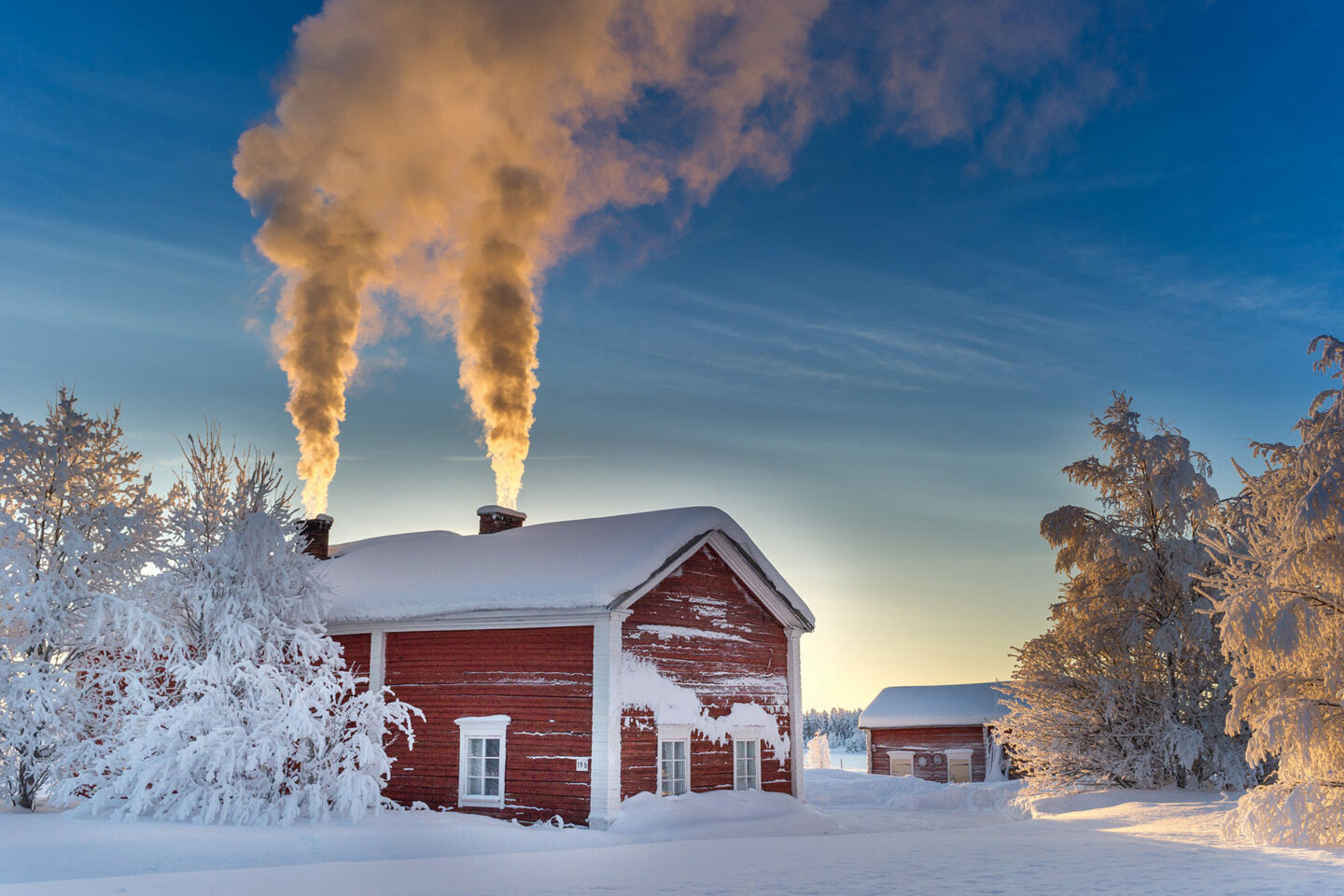 Dramatic chimneys in winter in Suvanto, a 19th century village and filming location in Finnish Lapland