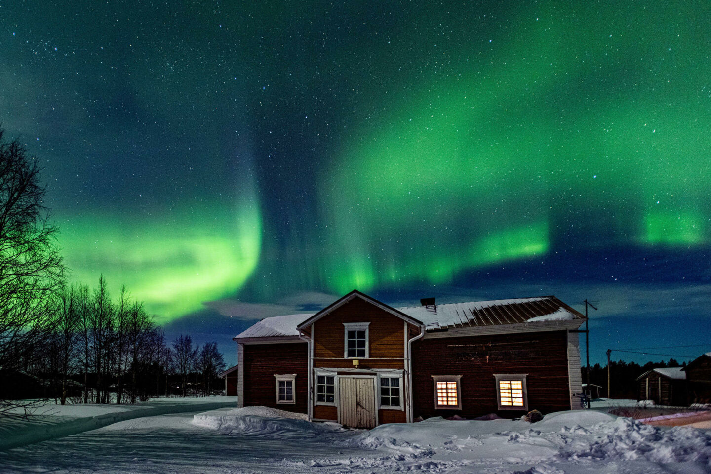Northern Lights over a cabin in Suvanto, a 19th century village and filming location in Finnish Lapland