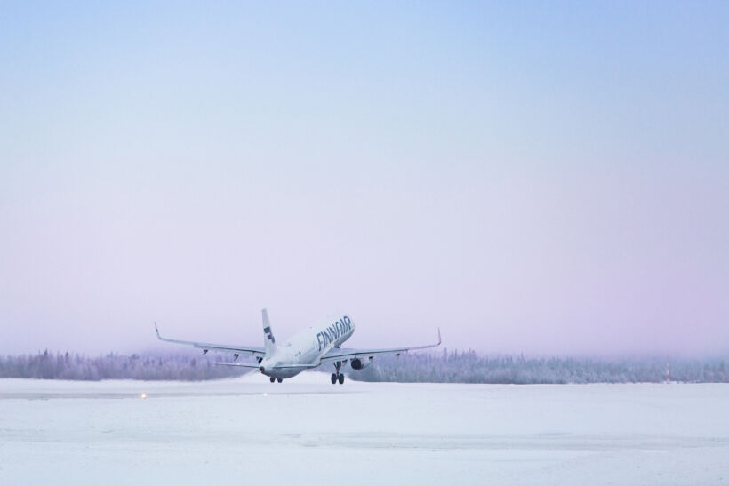 A plane takes off in winter at the Kittilä Arctic Airport, a filming location in Finnish Lapland