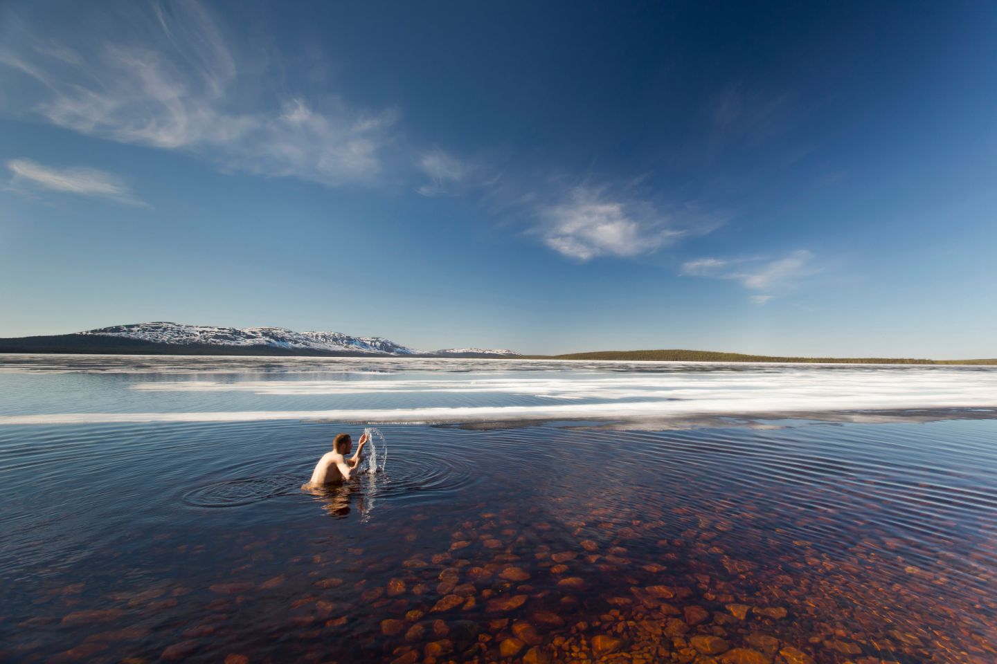 Going for a spring swim in Finnish Lapland