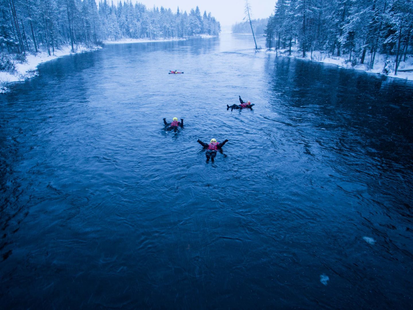 Floating on the river in winter in Ruka-Kuusamo, Finland